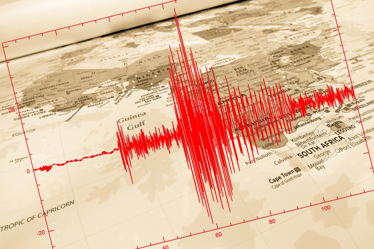 Red seismic wave over Africa map